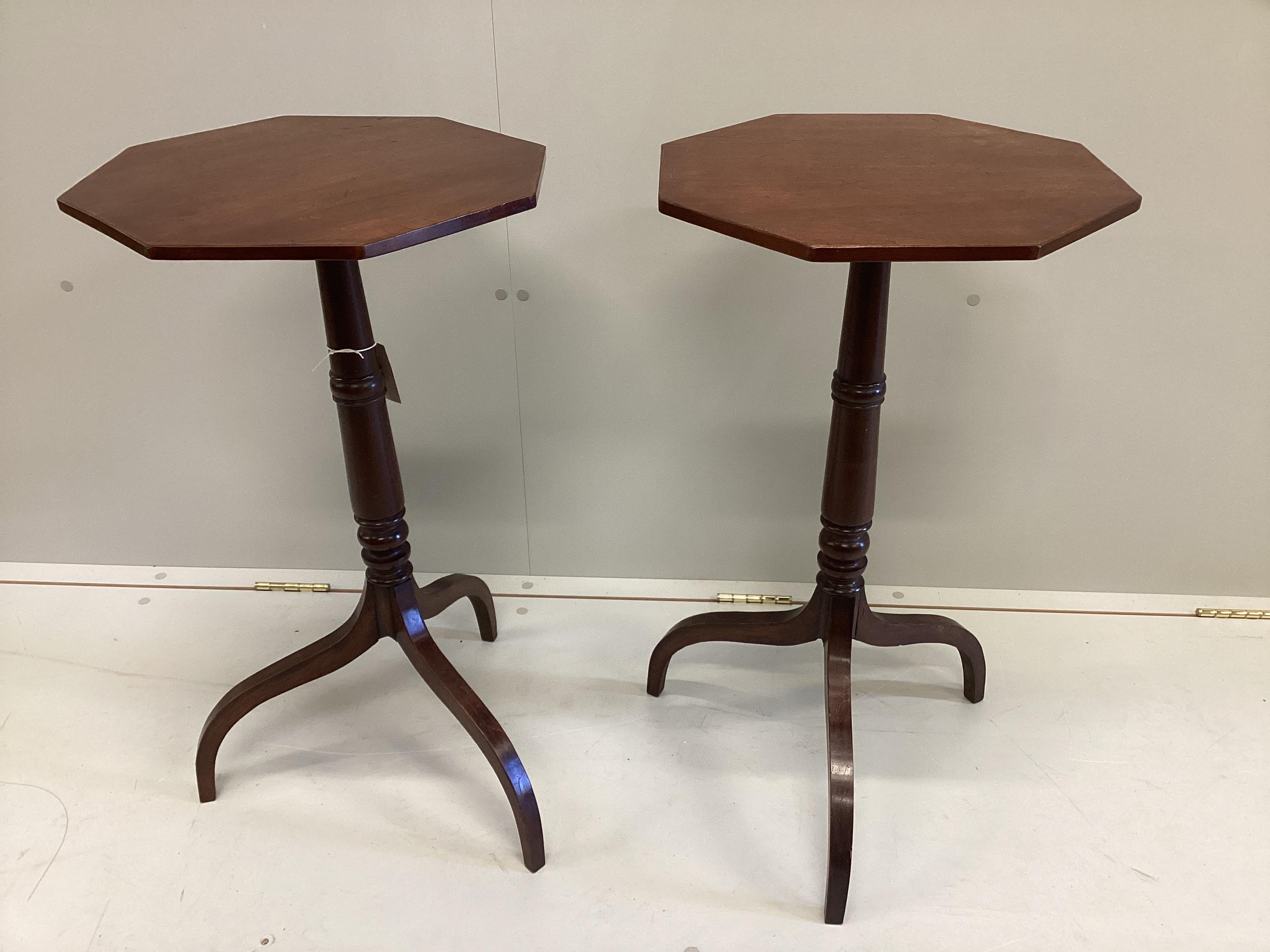 A pair of Regency style octagonal mahogany tripod wine tables, width 40cm, height 72cm